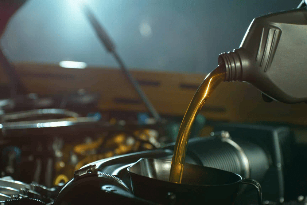 Synthetic Oil Change Near Smyrna, DE by Pristine Motorsports, an image of oil being poured into a car during routine oil change