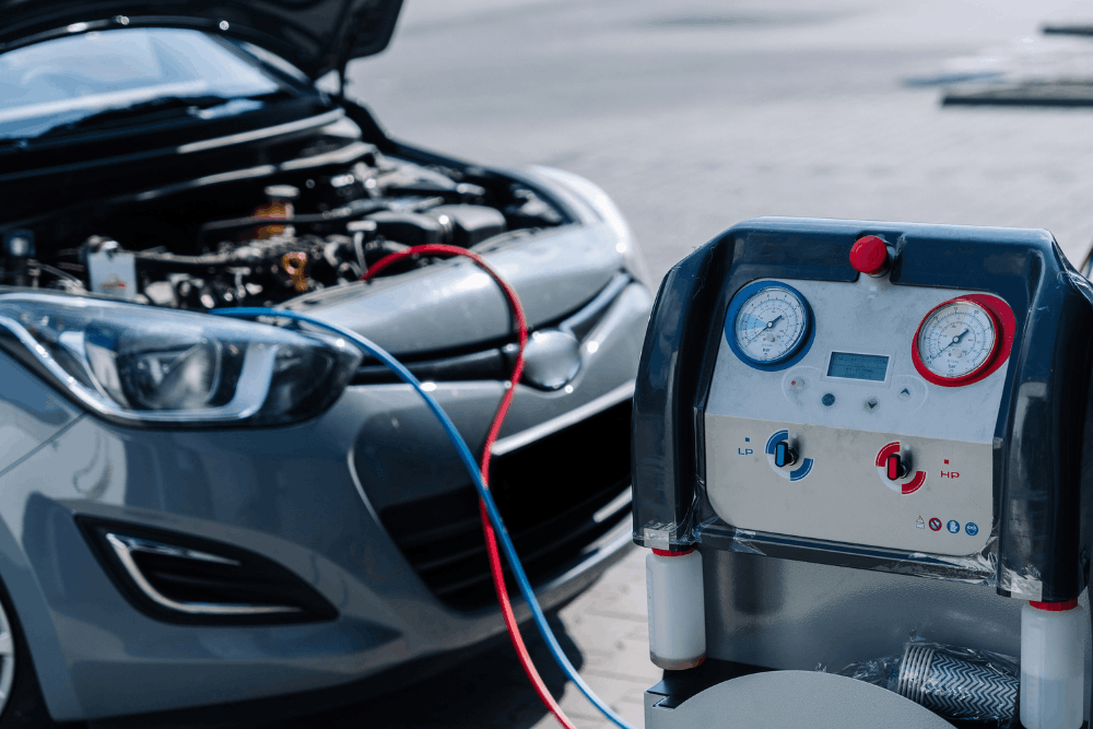 Auto air conditioning repair in Smyrna, DE, at Pristine Motorsports. Image of professional A/C service equipment connected to a vehicle for system diagnostics and refrigerant service, helping restore reliable cooling and comfortable summer driving.